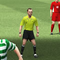 A referee on a football pitch during a match.
